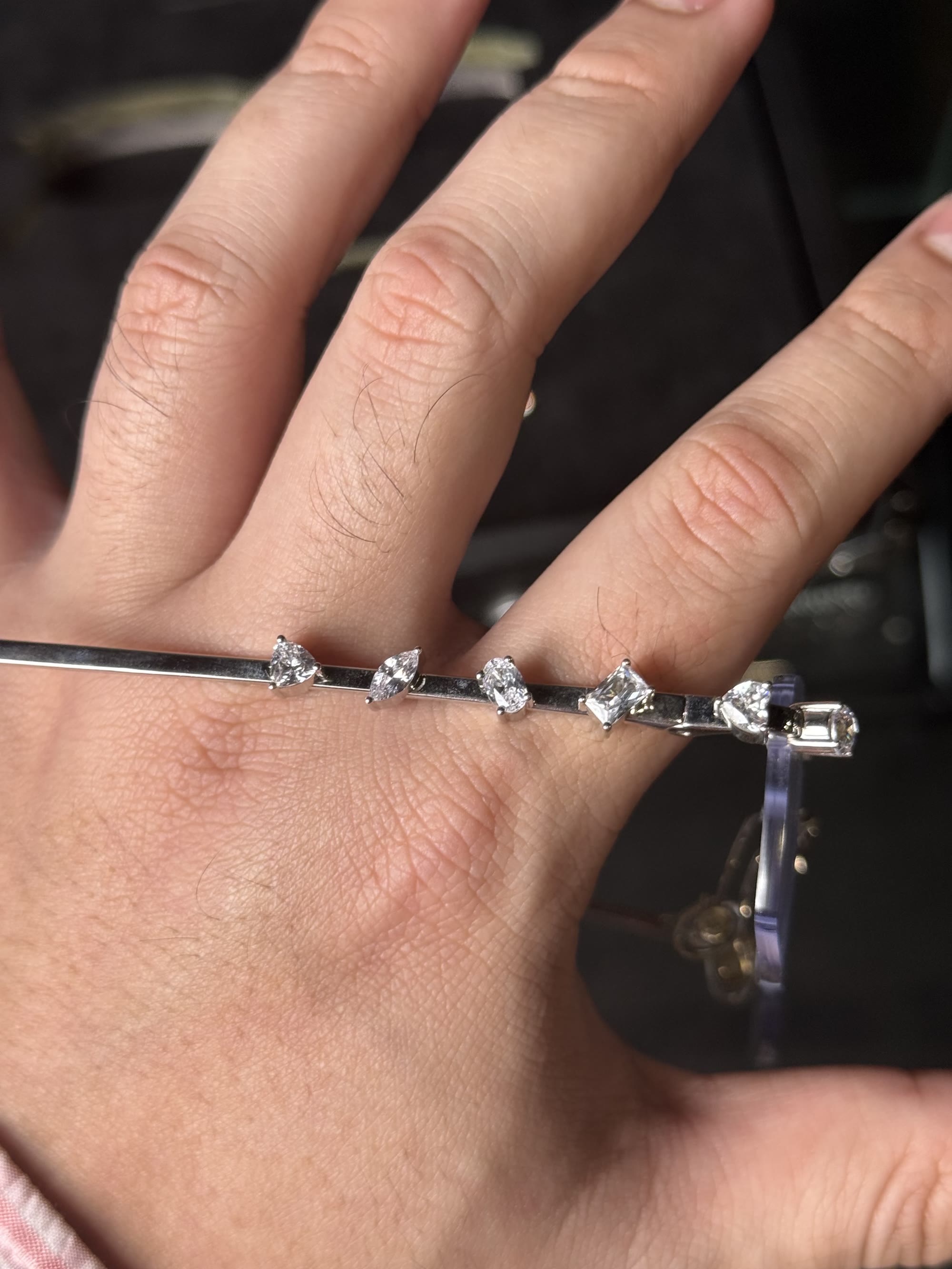 Macro of the temple: six differently cut diamonds in a row